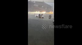 China: Torrential Downpour Sweeps Electric Scooter Away in Nanning
