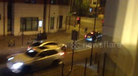 Impatient car drivers jump red lights every evening on a busy junction in Hackney