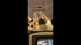 BA Cabin Crew struggle to get oxygen masks back in after they pop out during takeoff from Las Vegas to Heathrow 16th May