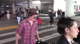 Brooklyn Beckham mobbed by paparazzi at LAX Airport