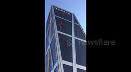 Greenpeace activists climb Madrid building to protest TTIP