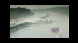 Heavy rain causes coach to flip on highway, killing two