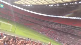 Grimsby fans celebrating Omar Bogles second goal against Forest Green Rovers in the National League Playoff Final at Wembley