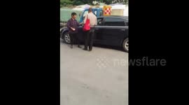 Beggars threaten drivers to give money with stone in hand