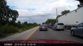 Semi Barrels Down Highway Shoulder