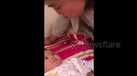 Five-month-old baby imitates mum's expressions