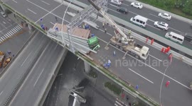 Trailer illegally driving on elevated road turns over and inclines bridge