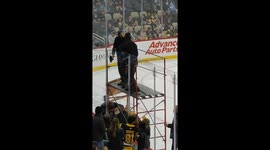 Quick changing of damaged hockey barrier during a Penguins hockey game in Pittsburgh.game.