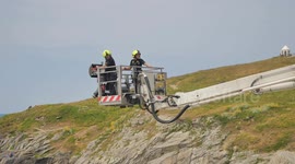 Fire and Rescue training by the sea with a Hydraulic Platform. Vema 343 TFL, Fistral beach, Newquay, Cornwall, UK