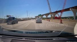 Driver Seen With Foot Hanging Out Open Door on Highway