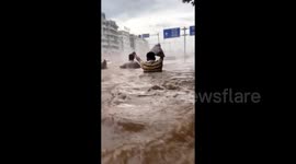 China's worst flooding in 30 years forces closure of main train station amid rising river levels
