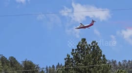 Plane drops red retardant on fire in Ruidoso