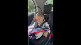 Mom tries to stop baby girl from falling asleep in the car