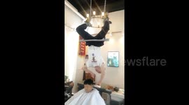 Kung fu hairdresser in China offers upside-down haircuts for £14