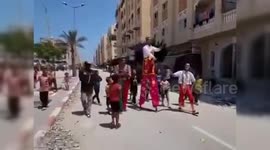 Palestine: Palestinian Man's Stilt-Walking Brings Joy to Children in Khan Younis Displacement Camps