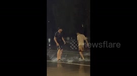 China: Puddle Play on a Rainy Day