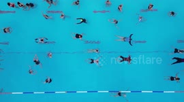 Dawn swimmers see in longest day with a splash