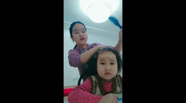 Sisterly styling: Bishkek's touching hair moment