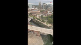 Man amusedly intrigued while witnessing a Naked Bike Ride through his window