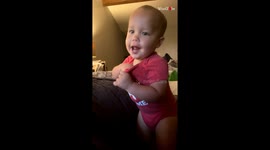 Sneaky toddler hides chicken nugget in her onesie