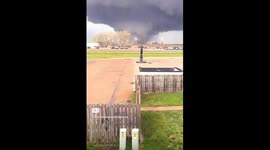 4/26/2024 Harlan Iowa Massive Wedge Tornado moving through open fields and almost taking out a farm house