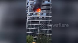 Man survives plunge failing from eighth floor to escape blaze