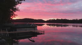 Beautiful pink skies water reflection sunrise on Lake Millicent