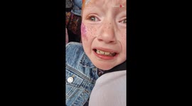 Appreciative 8 y/o Swiftie trembling with emotion while attending Eras Tour in Edinburgh