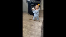 'Spin Cycle Startle' - Mom sneaks up on toddler fixated on washing machine
