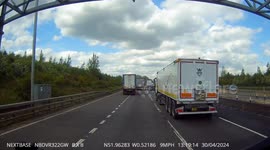 HGV going onto a slip road to undertake another HGV on the M1 near J12