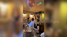 Teen's cake topper goes up in flames as her family sing happy birthday