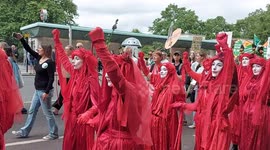 Extinction Rebellion's Red Rebels at the UK's biggest ever march for nature and climate