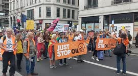 Just Stop Oil & nature protestors march through central London during the UK's biggest ever rally for nature & climate