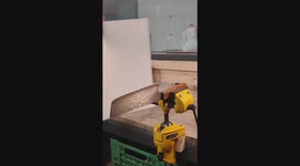 Testing the sharpness of a blade by pushing a thin paper through the edge of a handmade kitchen knife.