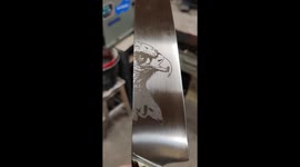 Handmade kitchen knife with a handle from nomex and 3 coloured epoxy, complemented with a hawk laserengraving.