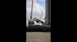 In the eye of a storm - when Storm Eunice tore the roof of The O2 in North Greenwich, London seen from a Uber Boat by Thames Clippers just before we had to tie the boat up due to extreme weather on the 18th February 2022.