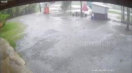 Wind flips over wooden hut as forecasters warn of heavy rain in Thailand
