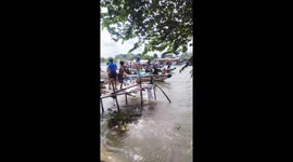Locals throw water at passing boat as fiesta hits town in the Philippines