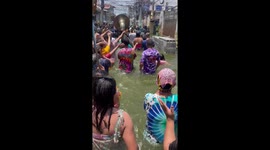Filipinos party through flooded street for awesome fiesta