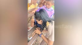 Teacher helps schoolboy whose leg stuck in metal bleacher seat
