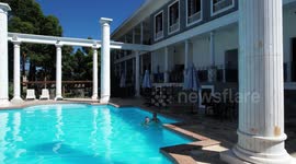 A mother and her son swimming in a wonderful open-air pool at the Aroso Paço Hotel located in Pedra Azul, Domingos Martins - ES - Brazil