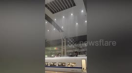 Rain pours through roof of Chinese train station during epic storm