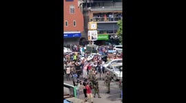 Kenyan protestors surround police car amid anti-tax hike demonstrations in Nairobi