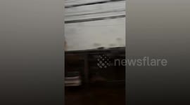 Strong storm blows metal sheets from roofs in Laos