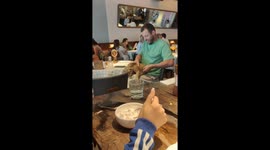 Russian man dines with lion cub in restaurant