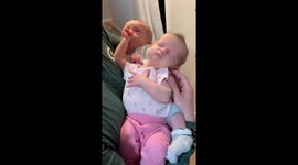 Baby Boy Sucks on Twin Sister's Thumb