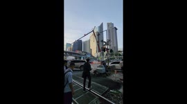 Level crossing barrier crashes onto car roof