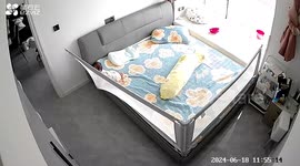 Curious baby pushes over bed rail and tumbles onto floor