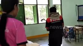 Python sparks panic when it slithers into schoolgirl's desk during class