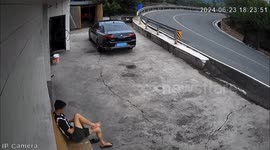 Bystander rushes away when lorry overturns yards from where he was sitting